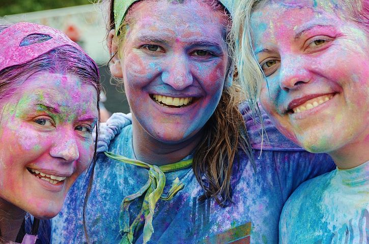 Three girls at charity paint running festival